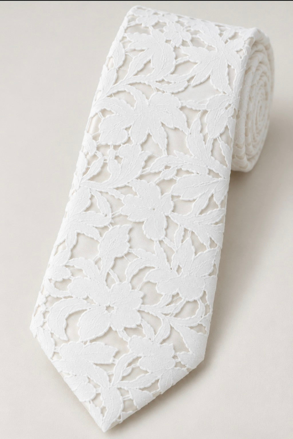 Lorenzo ivory floral lace groom's tie over ivory satin, rolled product photograph