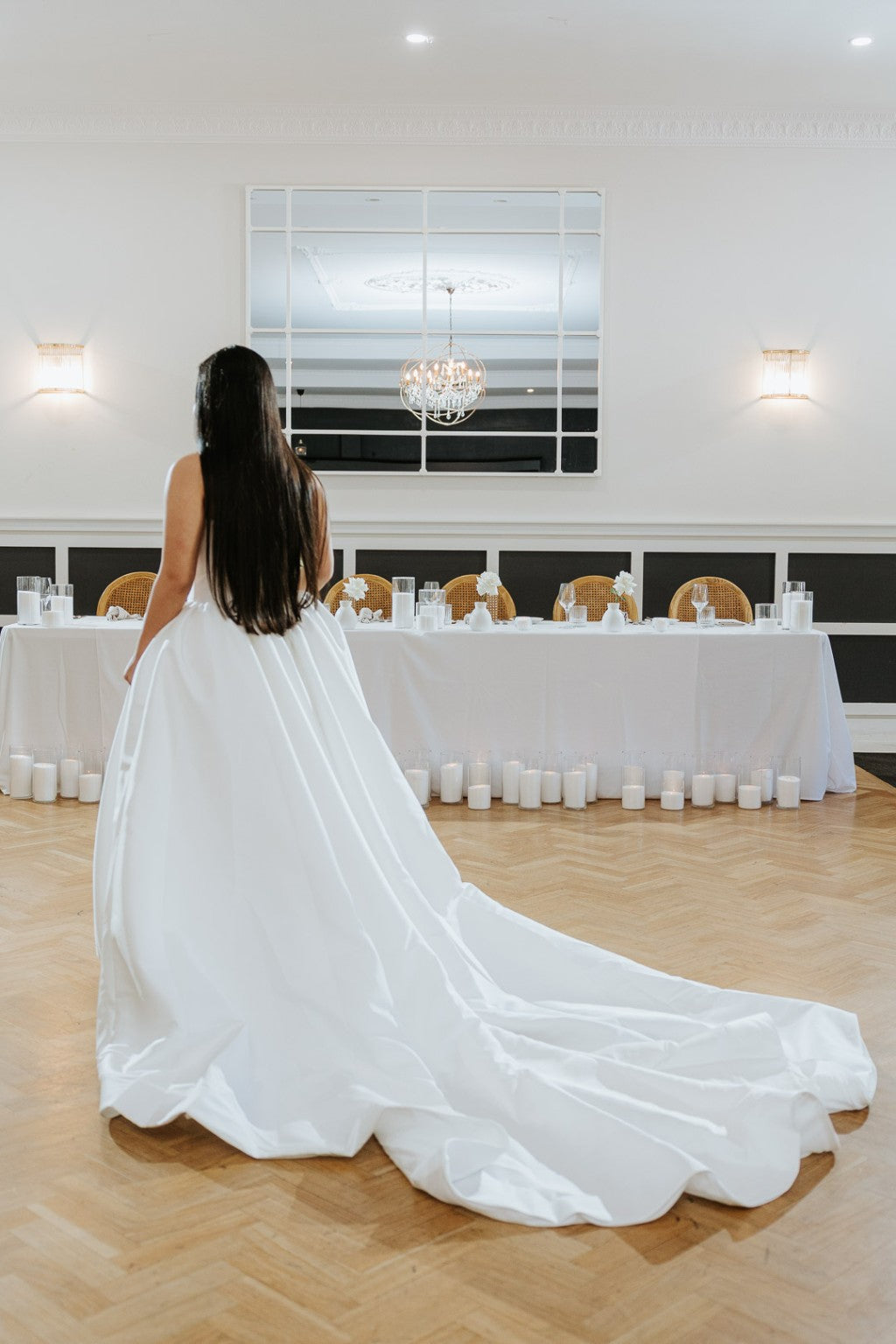 Back view of Allegra Mikado wedding gown with flowing train