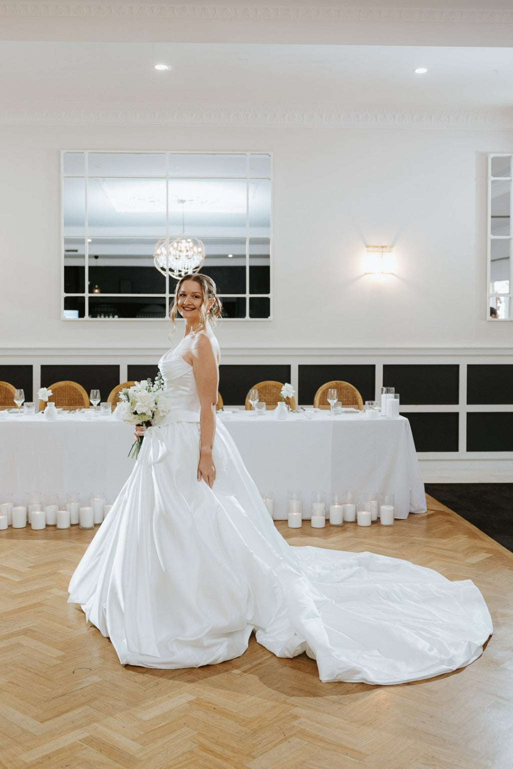 Side profile of Serafina satin ball gown and train