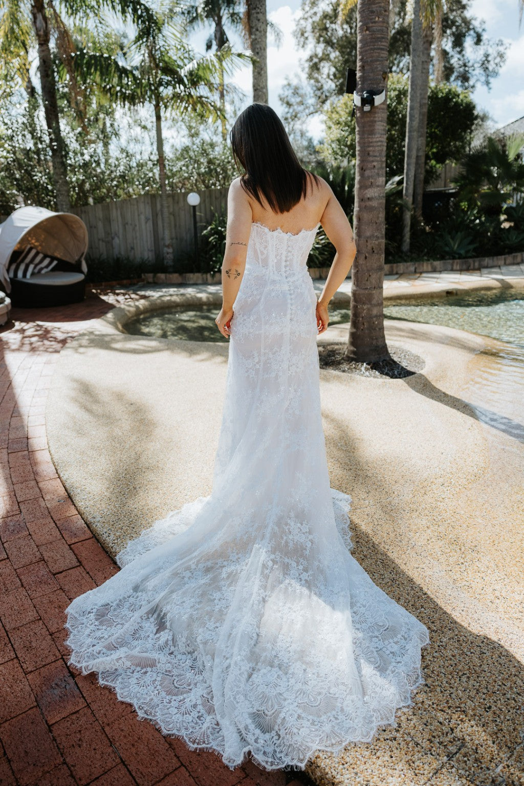 Vittoria lace gown back view with sweeping lace train